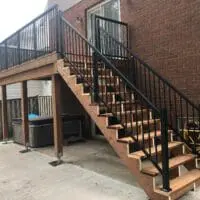Custom balcony and staircase with modern coated metal railings